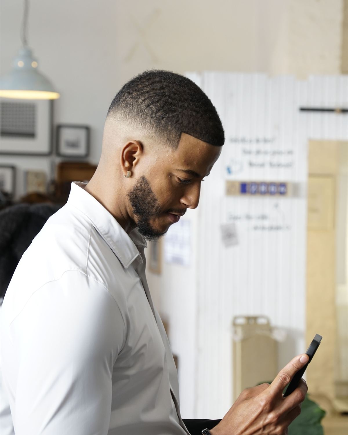 Business owner checking new customer enquiries on a phone