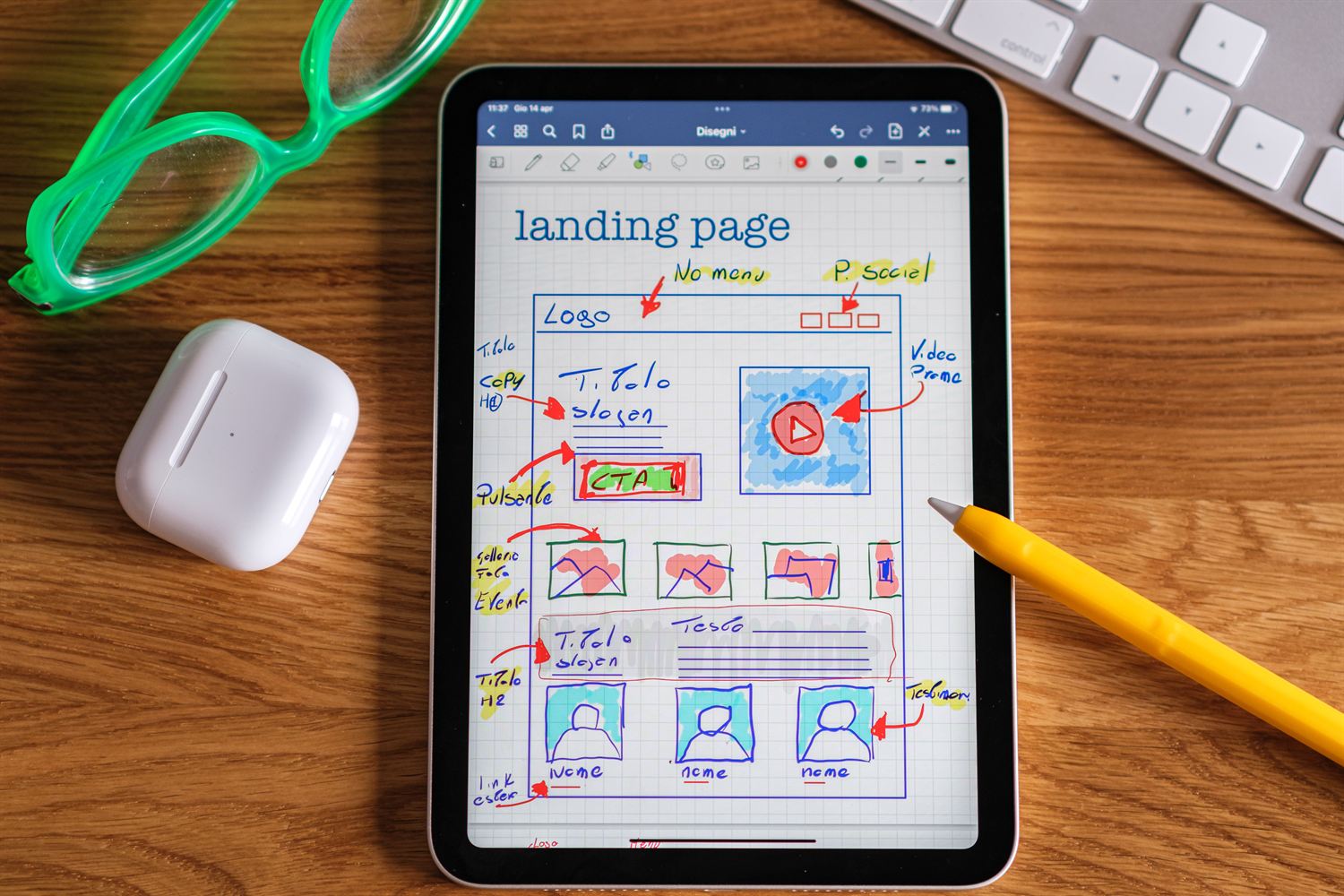 Landing page wireframe sketched on a tablet